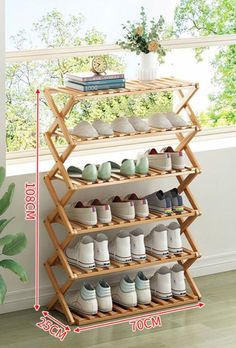 a wooden shoe rack with several pairs of shoes on it and measurements for each pair