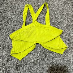 Cropped Halter Top Super Soft And Stretchy Spandex Like Material. Size M/L This Is In Great Condition Nwot. Summer Tops With Built-in Bra For Workout, Green Vacation Top With Built-in Bra, Yellow Stretch Top With Built-in Bra, Summer Workout Tops With Seamless Design, Trendy Seamless Beach Tops, Summer Triangle Top With Seamless Construction, Stretch Summer Tops For Workout, Yellow Seamless Beach Tops, Summer Workout Stretch Tops