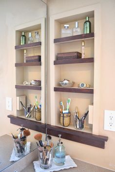 the bathroom is clean and ready to be used as a storage area for toothbrushes