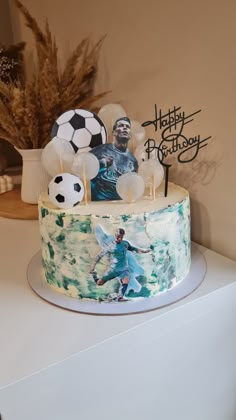 a birthday cake decorated with an image of a soccer player