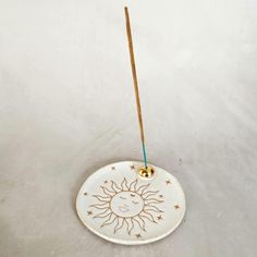 The Ceramic Sun incense holder was handmade by me using a slab technique which gives it a unique and rustic look. Use it to hold your incense and palo santo. The incense holder is glazed in a white  glossy finish on a white clay. The bottom and design are left raw. The top holder is painted with a gold lustre. Every item with gold paint or gold illustration required a third firing. Diameter : 12 cm (approx) Due to the fact that this piece is handmade you may find slight variations in the shape, Sun Incense Holder, Pottery Incense Holder, Incense Holder Ceramic, Ceramic Sun, Gold Illustration, Ceramic Incense Burner, Ceramic Incense Holder, Ceramic Incense, Pottery Gifts