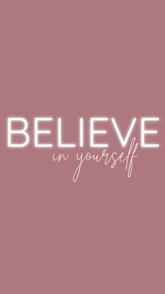 the words believe in yourself against a pink background