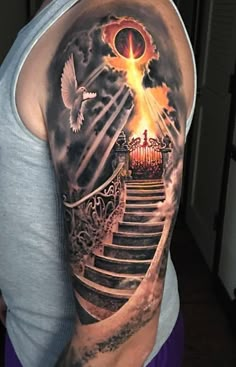 a man with a tattoo on his arm that has stairs leading up to an open door