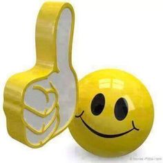 a smiley face ball with a thumbs up sign