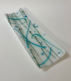 a glass plate with blue and green lines on it