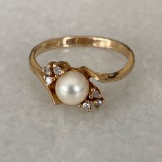 10k Gold Pearl And Stones Width Is A 1/2 Inch Size: 6.5 10k Gold Ring, 5 Rings, Pearl Color, Gold Pearl, 10k Gold, Womens Jewelry Rings, Gold Ring, Gold Rings, Thing 1