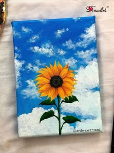 a painting of a yellow sunflower on a blue sky with clouds