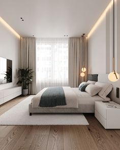 a modern bedroom with white walls and wood flooring, along with a large bed