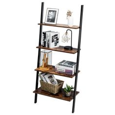 three tiered shelving unit with books and pictures on the top, one shelf holding various items