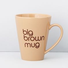 a coffee cup with the words'big brown mug'written in black on it