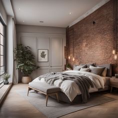 a bedroom with brick walls and large windows