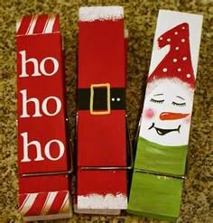 three red and white boxes with santa claus on them sitting on the floor next to each other