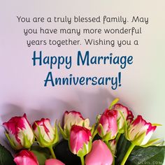 a bouquet of flowers sitting on top of a table next to a sign that says, you are truly blessing family may you have many more wonderful years together