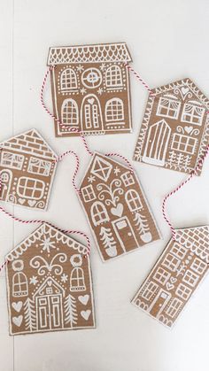 gingerbread cut out houses with twine and twine on the string, ready to be used as ornaments