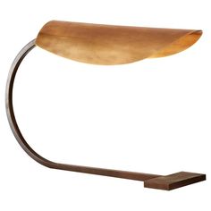 a table lamp that is on top of a wooden stand