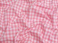 the pink and white checkered fabric is very close to it's surface,