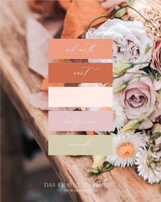 a bouquet of flowers sitting on top of a wooden table