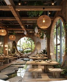 the interior of a restaurant with tables, benches and hanging plants on the wall above them