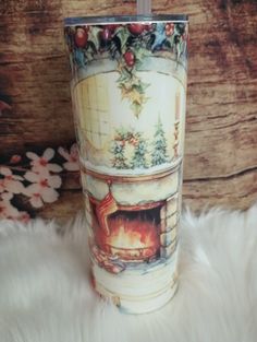 a christmas themed cup sitting on top of a white furnishing next to a wooden wall