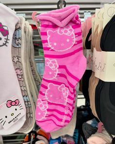 hello kitty socks are hanging on the rack