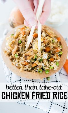 chicken fried rice on a plate with carrots and celery in the background