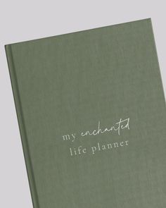 a green book with white writing that says, my abundant life planner on the cover