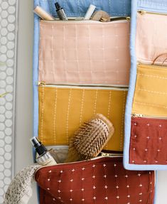 three zippered pouches with various items in them sitting on top of each other