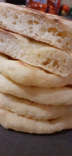 a stack of sliced bread sitting on top of a table