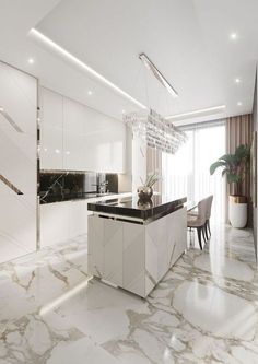 a modern kitchen with marble floors and white cabinets, along with a dining room table that has a chandelier hanging from the ceiling