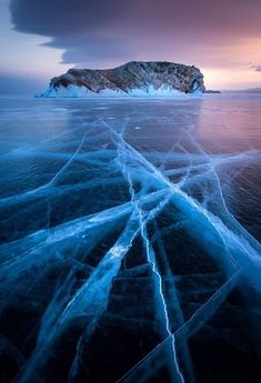 an ice floet is shown in front of a mountain and body of water