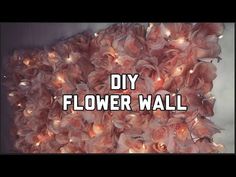 the words diy flower wall are displayed in front of a large pile of flowers