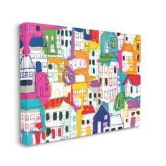 a colorful cityscape with lots of houses on it's sides canvas wall art print