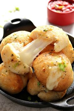 some food is sitting in a pan on the table and ready to be eaten by someone