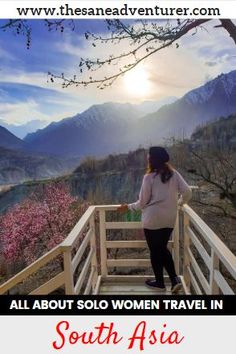 a woman standing on top of a wooden bridge next to flowers and mountains with the words south asia above her