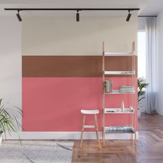 a living room with pink, brown and white walls