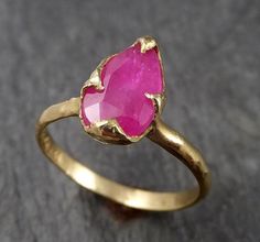 I created this setting in wax then cast it in recycled solid 18k Yellow gold at my home studio. This ring is a size 7 it can be sized. The stone is a Burma Ruby. it measures about 10mm X 6mm I created a rustic texture in the gold. Throughout all time and history, in every tribe and culture all around the world crystals, minerals and gemstones have used for healing, luck, divination, adornment vibrational medicine and so much more. Ruby encourages passion and a zest for life. It improves motivati Garnet Gold Ring, Rough Gemstone Jewelry, Vibrational Medicine, Rustic Texture, Garnet And Gold, Minerals And Gemstones, Watermelon Tourmaline, Rough Gemstone, Ring Gemstone