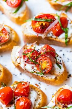 several slices of bread topped with tomatoes and cheese