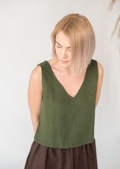 "Relaxed fit sleeveless linen crop top with wide V-neck creates a romantic and careless look. Because of its versatility suitable in many combinations and for various occassions. Something that doesn't require time or effort to make you look stylish and subtly seductive. DETAILS - Relaxed fit - Fits true to size - can be made shorter or longer depending on your preference - Wide V neckline - Sleeveless - 100% midweight 185 g/m2 European softened linen fabric - Oeko Tex certified linen - Various Cropped Linen Top For Summer, Summer Cropped Linen Tops, Green Relaxed Fit Crop Top For Summer, Summer Green Linen Tops, Sleeveless Linen Crop Top For Spring, Green Linen Summer Tops, Sleeveless Linen Crop Top For Summer, Relaxed Fit Sleeveless Crop Top, Relaxed Fit V-neck Crop Top For Summer