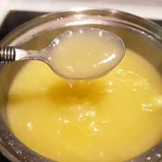 a spoon is being used to stir food in a saucepan