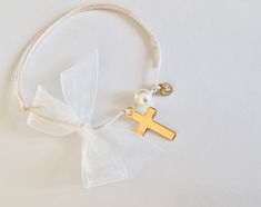 Witness Pins-Martirika-Greek Baptism-Cross Martirika-Bracelet Martirika-bracelet martyrika for girls-heart martyrika. Elegant martirika made into a bracelet look. Ivory cord with gold tone cross, gold/rhinestone heart, bead and ivory ribbon made into a bow. This listing is for 20 pieces. Martirika will come in a decorated box/basket or tray. Please contact me If you like another *quantity, color cord or tulle. Cross Gold, Girls Heart, Baptism Favors, How To Make Ribbon, Rhinestone Heart, Gold Rhinestone, Blue Bracelet, Blue And Silver, Antique Gold