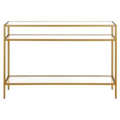 a gold metal and glass console table with two shelves on one side, against a white background