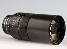 a camera lens sitting on top of a white table