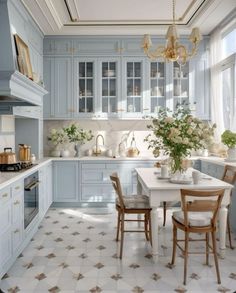 a kitchen with blue cabinets and white counter tops