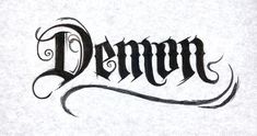 the word demon written in black ink on white paper