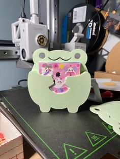 an animal shaped card sitting on top of a table