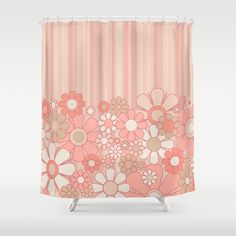 a shower curtain with pink and white flowers on the outside, in front of a striped background