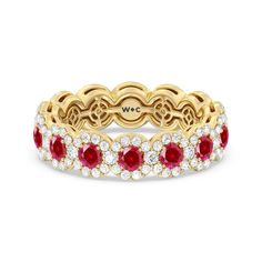 an 18k yellow gold ring with red and white diamonds