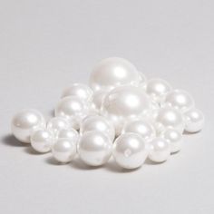 ASSORTED SIZES PEARLS - WHITE SIZE: 14, 20, 30MM 1 Pound Bag Each Bag Contains:  - 30mm x 4pc - 20mm x 20pc - 14mm x 60pc Pearls make sophisticated and stunning accent pieces. Use our white assorted pearls to bring their elegant look to your event. Our white pearls come in multiple sizes so you can have the right size options for you. DecoStar Professional Decor Products - Learn More at www.DecoStarCo.com Romantic Wedding Centerpieces, Pearl Centerpiece, Event Decor Direct, Deco Beads, Pearls Diy, Professional Decor, White Vase, Vintage Wedding Decorations, Glass Butterfly