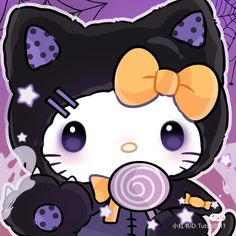 a hello kitty holding a lollipop in her hand