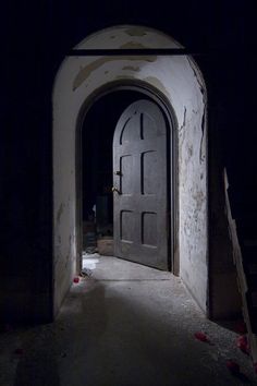 an open door leading into a dark room